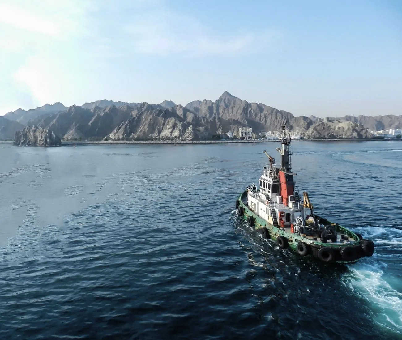 Tugboat navigates on the sea. 